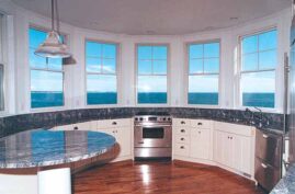 A great kitchen with a magnificent view. Design by Dennis R. Tefft of Downeast Building Supply.
